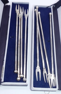 Lot 315 - A set of four continental silver fondue forks,...