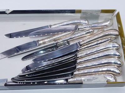 Lot 319 - Two sets of six table knives, each having...