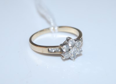 Lot 375 - A contemporary 9ct gold diamond flower head...