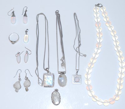 Lot 393 - A collection of white metal and moonstone set...