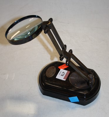 Lot 478 - A reproduction adjustable table top magnifier