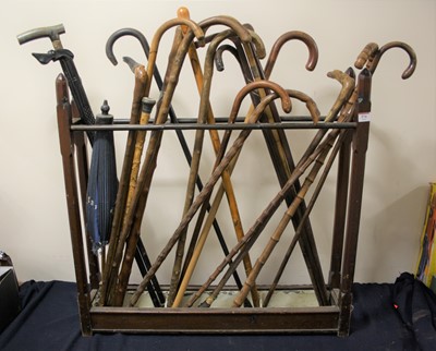 Lot 574 - A pine stick stand containing a large...