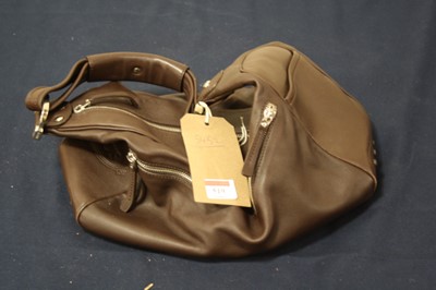 Lot 519 - A lady's Tod's brown leather handbag, having...