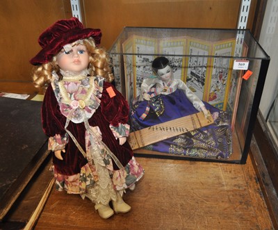 Lot 569 - A modern doll, on stand, height 43cm, together...