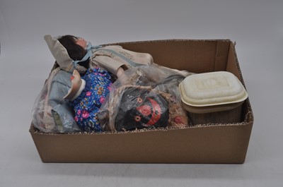 Lot 565 - A collection of vintage dolls to include a...