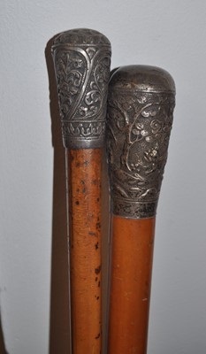 Lot 558 - An eastern white metal handled walking stick,...