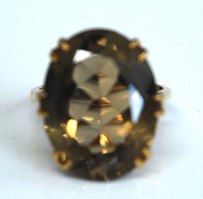 Lot 2533 - A 9ct yellow gold smoky quartz dress ring, the...