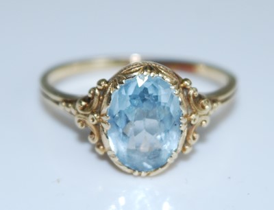 Lot 2550 - A yellow metal aquamarine dress ring, having...