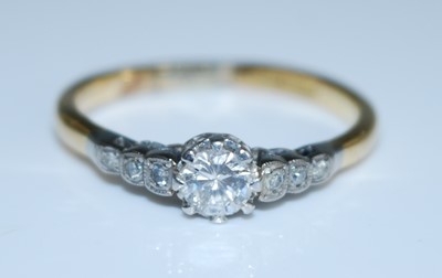 Lot 2554 - A yellow and white metal diamond single stone...