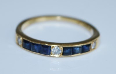 Lot 2571 - An 18ct yellow gold, sapphire and diamond half...