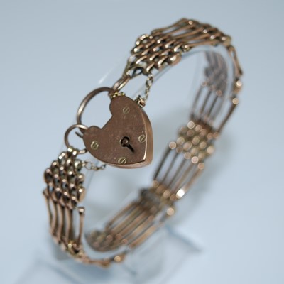 Lot 2585 - A yellow metal five bar gate link bracelet...