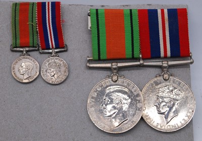 Lot 81 - A WW II Defence and War medal pair, together...