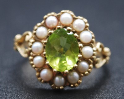 Lot 2604 - A 9ct yellow gold, peridot and pearl oval...