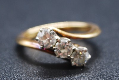 Lot 2606 - An 18ct yellow and white gold diamond three...