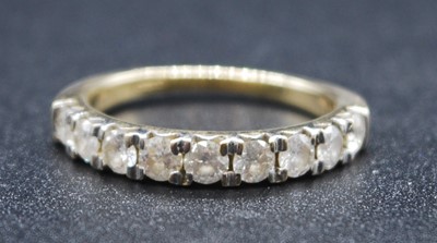 Lot 2608 - A 9ct yellow and white gold diamond half...