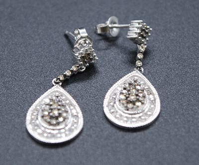 Lot 2611 - A pair of 9ct white gold and diamond pear...