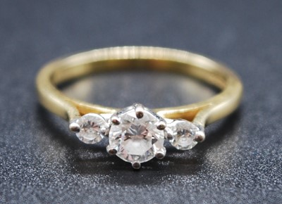 Lot 2616 - An 18ct yellow and white gold, diamond three...