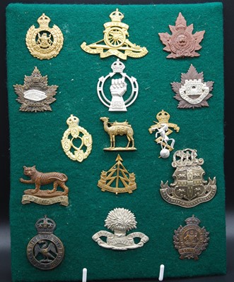 Lot 63 - A collection of cap badges mainly being...