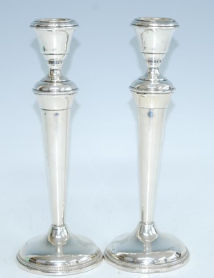 Lot 2166 - A pair of George V loaded silver table...