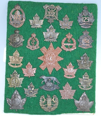 Lot 64 - A collection of Canadian cap badges and...