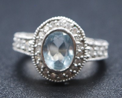Lot 2622 - A white metal, aquamarine and diamond oval...
