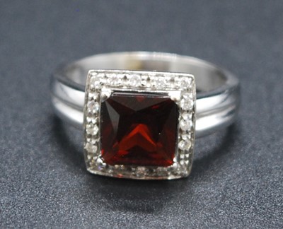 Lot 2625 - A white metal, garnet and diamond square...