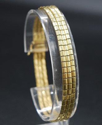 Lot 2636 - A modern 18ct yellow gold triple strand...