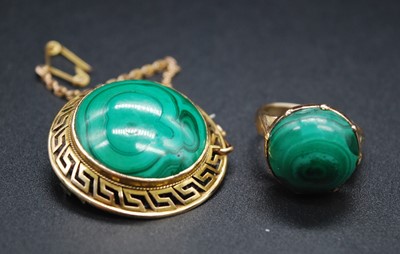Lot 2655 - A yellow metal malachite dress ring, the...