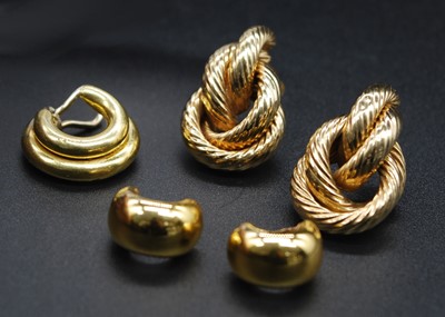 Lot 2663 - A pair of modern 18ct hollow gold ear studs,...