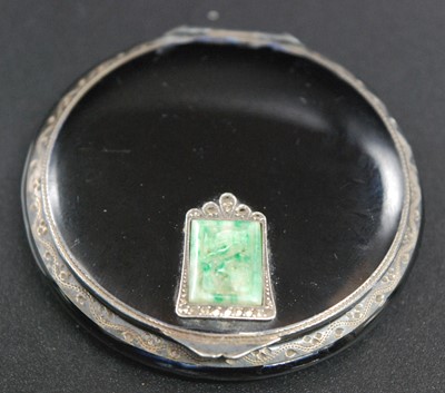 Lot 2683 - An Art Deco lady's black enamel on white metal...