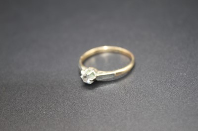 Lot 2775 - A 9ct gold and platinum diamond solitaire ring,...