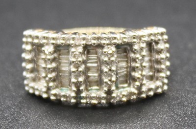 Lot 2826 - A modern 9ct gold and diamond set half hoop...
