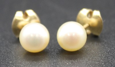 Lot 2835 - A pair of yellow metal single pearl stud...