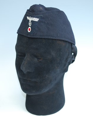 Lot 207 - A reproduction German side cap of cotton...
