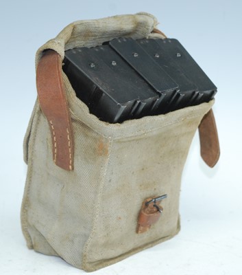 Lot 141 - A WW II canvas and brown leather magazine...