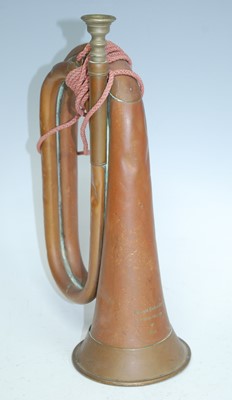 Lot 211 - A post WW II copper and brass bugle, stamped...
