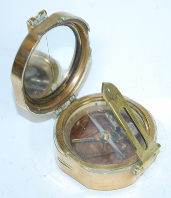 Lot 112 - A WW II brass cased Brunton style military...