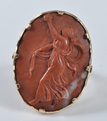 Lot 2182 - A yellow metal oval lava stone cameo ring,...