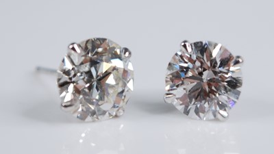 Lot 2190 - A pair of Edwardian platinum diamond set ear...