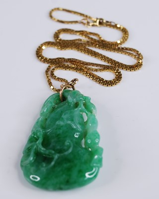Lot 2218 - A Chinese carved green and celadon jade...