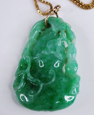 Lot 2218 - A Chinese carved green and celadon jade...