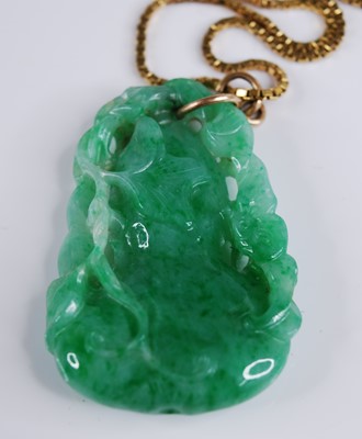 Lot 2218 - A Chinese carved green and celadon jade...