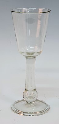 Lot 2106 - A large Georgian wine glass, the round funnel...