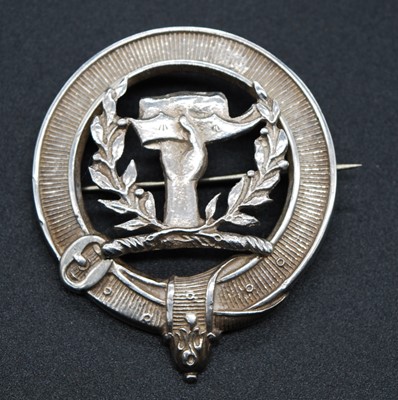 Lot 25 - A 20th century white metal clan badge,...