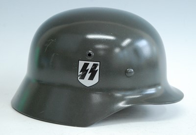 Lot 167 - A reproduction German M 1935 steel helmet with...