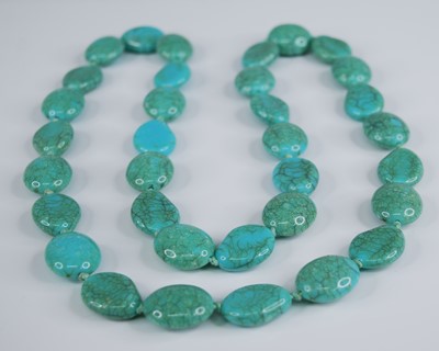Lot 2261 - A turquoise necklace, comprising 34 oval...