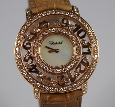 Lot 2326 - A lady's Chopard 18ct gold 'Happy Diamonds...