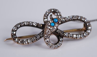 Lot 2192 - An Edwardian yellow metal diamond set snake...