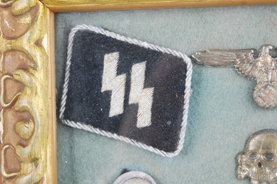 Lot 299 - A framed display of items relating to The 17th...
