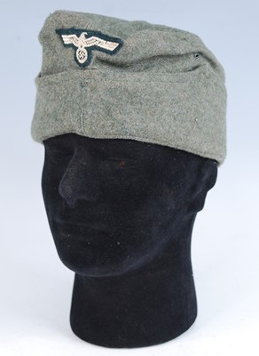 Lot 265 - A replica German Army Overseas side cap, in...